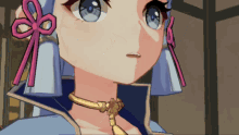 a close up of a girl 's face with blue eyes and a gold necklace