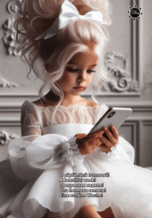 a little girl in a white dress looks at her phone