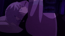 a person with purple hair is laying down in a dark room with their eyes closed