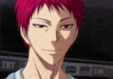 a man with red hair is smiling in front of a sign that says " trt "