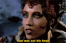 a close up of a woman 's face with the words that was not his knee below her