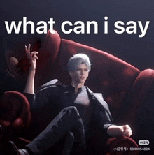 a man is sitting on a red couch with the words `` what can i say '' written on it .