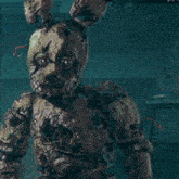 a close up of a statue of a rabbit with a hole in his head .
