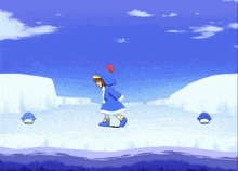 a girl in a blue penguin costume is standing on a snowy surface