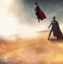 batman and superman are flying in the air