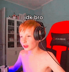a shirtless boy wearing headphones and a zombie gaming chair