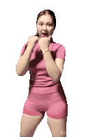 a woman in a pink shirt and shorts is dancing with the words dorrr mazchi on the bottom