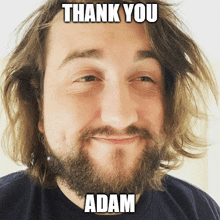 a man with a beard is smiling with the words thank you adam above him