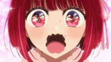 a close up of a girl 's face with red hair