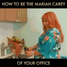 a woman with red hair is washing dishes in a kitchen
