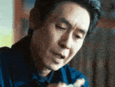 a close up of a man 's face with a serious look on his face