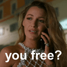 a woman talking on a cell phone with the words " you free " written below her