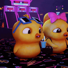 a couple of cartoon ducks standing next to each other with one wearing sunglasses and a pink bow