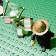 a person wearing a hat is standing next to a robot on a green surface