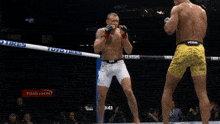 a t mobile arena sign is behind a fighter
