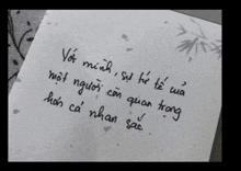 a piece of paper with writing in a foreign language on it