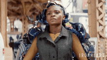 a woman is sitting in a chair with the words ironheart written on the bottom
