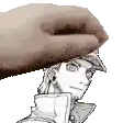 a hand is holding a drawing of a man 's head in a hat .