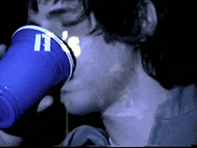 a blue cup with the number 11 on it