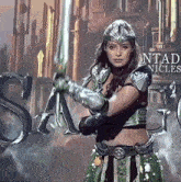 a woman holding a sword in front of a sign that says sand