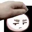 a close up of a person 's hand covering a face .