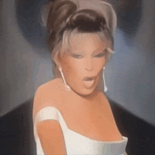 a woman in a white dress with a plunging neckline