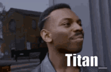 a man with the word titan on his face .