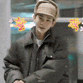 a man wearing a hat and a jacket has the word almighty on the bottom