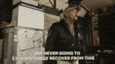 a man is standing in front of a refrigerator with the words `` i am never going to emotionally recover from this ''