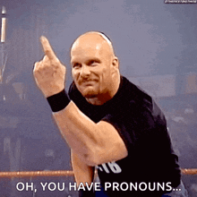 a wrestler is giving the middle finger and saying oh , you have pronouns