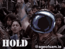 a pixel art of a man holding a helmet in front of a crowd with the words hold above him