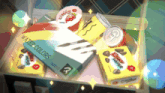 a box of watercolors sits next to a box of choco wrappers