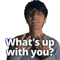 a man wearing glasses is smiling and says what 's up with you