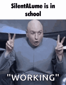 a bald man is giving a peace sign and saying `` silent alume is in school working '' .
