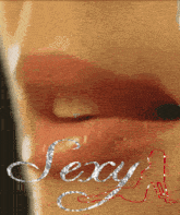 a close up of a woman 's lips with the words sexy written on it