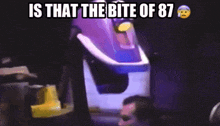 a man sitting in front of a roller coaster with the words is that the bite of 87 above him