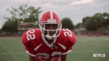 a football player in a red uniform with the number 22 on it