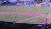 a baseball game is being played in front of a scoreboard that says ' ny ' on it