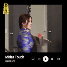 a video of a woman dancing with the song midas touch on the screen