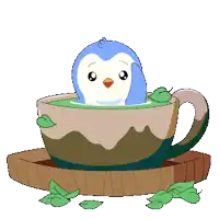 a penguin is sitting in a cup of tea
