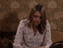 Tracy Looking Up And Brushing Her Hair Back Coronation Street GIF