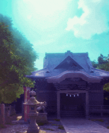 a temple with a blue sky and trees in the background