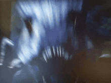 a close up of a monster 's mouth and teeth