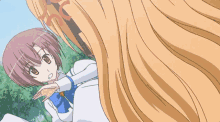 a girl with purple hair is standing next to a girl with long blonde hair