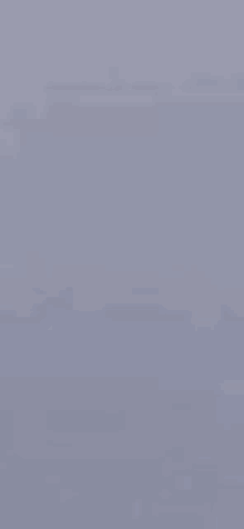 a close up of a gray surface with a grainy texture .