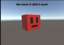 a red cube with a black face and the words me when it did n't work below it