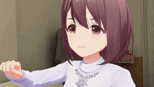 a girl wearing a white sweater with a necklace that says ' a ' on it