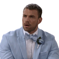 a man in a light blue tuxedo with a bow tie