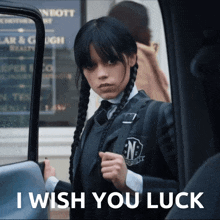 a girl in a school uniform is standing in a car with the words i wish you luck below her