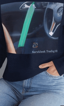 a woman wearing a sweater that says korvkiosk trading hb on it